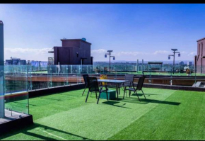 executive cozy apartment with fully equipped gym heated swimming pool and amazing scenic city views and ample parking and children playing ground